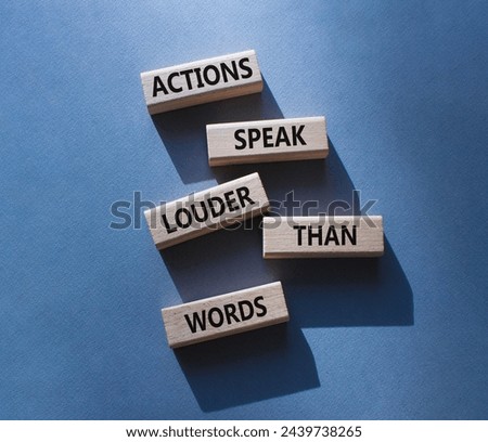 Actions speak louder than Words symbol. Wooden blocks with words Actions speak louder than Words. Beautiful grey background. Business and Actions concept. Copy space.