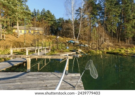Wooden house, gazebo for relaxation in the forest on the shore of the lake