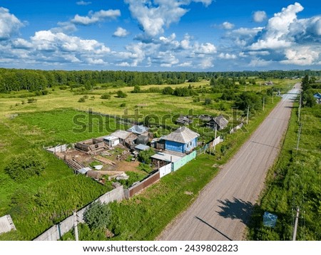 Construction of a rural house on the site of an old house and organization of personal farming in central Russia, selective focus Royalty-Free Stock Photo #2439802823