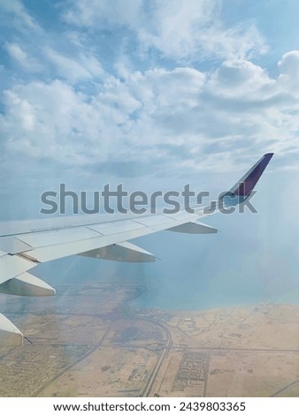 A picture of the city of Qatar, the sea and the city, from where it was taken while flying in the clouds