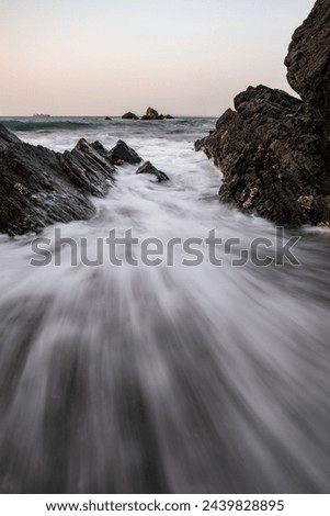 Beautiful waves crashing against the rocks