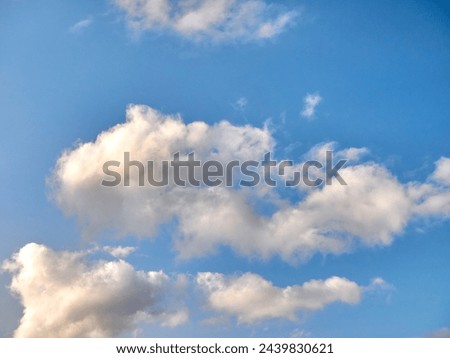White fluffy clouds in the deep blue sky. Heaven background