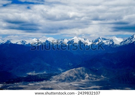 Landscape captured at Khardungla pass while traveling from Leh to Hunder town  Royalty-Free Stock Photo #2439832107