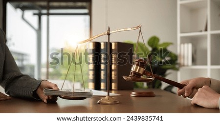 Dollar and judge's hammer on the scale The concept of corruption in the law Lobby for the implementation of anti-corruption laws or norms. Payment of fines and penalties Damage compensation award Royalty-Free Stock Photo #2439835741