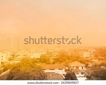 PM 2.5 Smog Dust in City with Sunset, Smoke Pollution Toxic Bad Destroys Health People,Air Problem Allergy Respiratory, View Building Tower Cityscape Hazaพd Carbon Climate Peril,Concept global warming Royalty-Free Stock Photo #2439849857