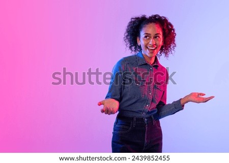 Welcoming woman with curly hair and open arms, colorful illuminated background