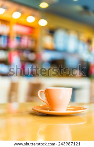 Coffee cup on wooden table in coffee shop - vintage effect style pictures
