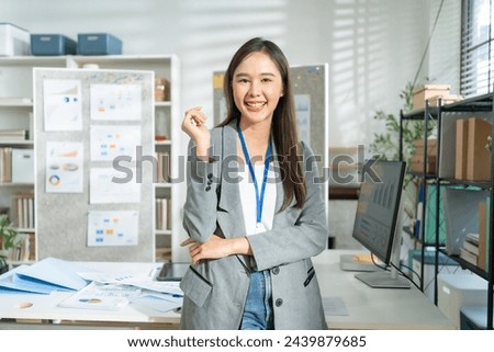 Portrait of Happy young Asian businesswoman looking at camera,arms crossed folded.Smiling woman executive manager,secretary offering professional business services standing in office. 