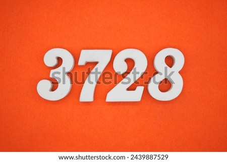 Orange felt is the background. The numbers 3728 are made from white painted wood.