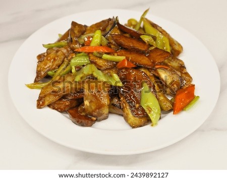 Closeup shot of the delicious Chinese food. Traditional Di San Xian. Stir-fried potatoes, eggplants and sweet peppers. Taken with a medium format camera.