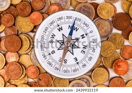 Picture of a Business Money Concept Idea Coins and Compass