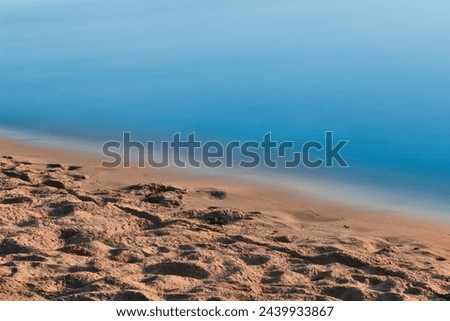 Wave of the sea on the sand beach. minimalistic scene of near the beach. long exposure photography