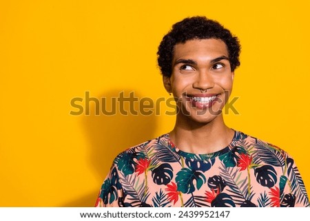 Photo of young cheerful guy with piercing hipster style toothy beaming smile look mockup thoughts isolated on yellow color background