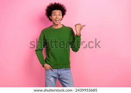 Photo of happy positive guy impressed discount adverts point empty space isolated pastel color background