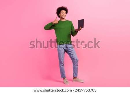 Photo of guy worker standing using netbook using netbook isolated pastel color background