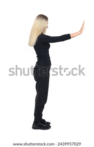 side view of a  woman showing the stop sign with their hands on white background