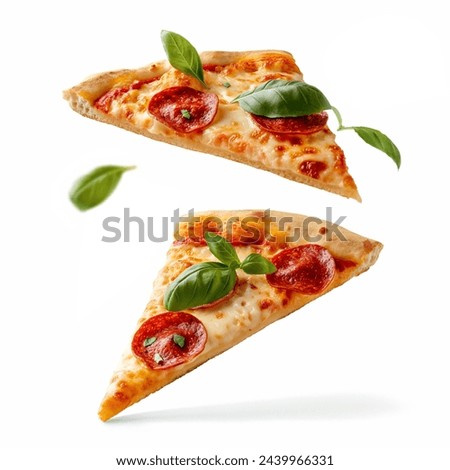 Pizza slices flying, isolated on white background. Delicious peperoni pizza slices pepperonis and olives, floating pizza pieces with melting cheese with basil leaves flying. Italian style pizza slices Royalty-Free Stock Photo #2439966331