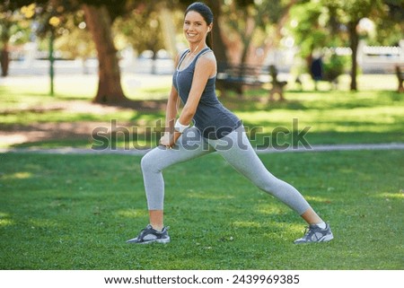 Portrait, smile and woman with earphones for stretching, training and podcast for exercise motivation. Female person, happy and fitness in park with balance warm up, cardio and music in headphones