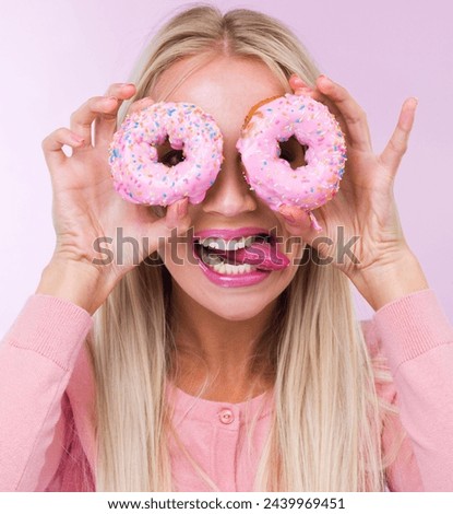 Donut, silly and portrait in studio for dessert, frosting and pink for sprinkles and sweet for sugar and crazy. Young person with tongue out for funny, comic and pastry for cake and icing for color Royalty-Free Stock Photo #2439969451