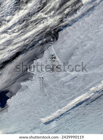 Shipwaveshape wave clouds induced by South Sandwich Islands. Shipwaveshape wave clouds induced by South Sandwich Islands. Elements of this image furnished by NASA. Royalty-Free Stock Photo #2439990119