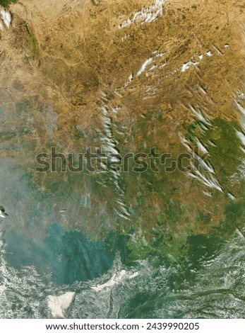 Fires in Central Africa afternoon overpass. Fires in Central Africa afternoon overpass. Elements of this image furnished by NASA. Royalty-Free Stock Photo #2439990205