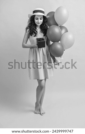 birthday woman with gift balloons in studio. birthday woman with gift balloons