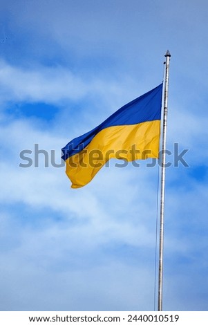 Flag of ukraine against the blue sky close-up. National pride and symbol of the country Ukraine. War in Ukraine. Yellow-blue flag.