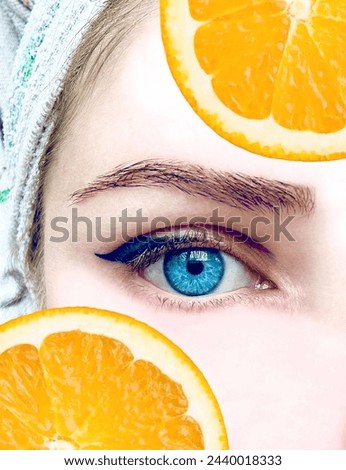 Woman Face with orange pices On Light Background  Royalty-Free Stock Photo #2440018333