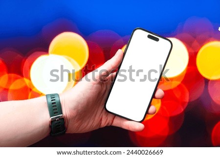 Smartphone screen mockup against a background of bokeh lights