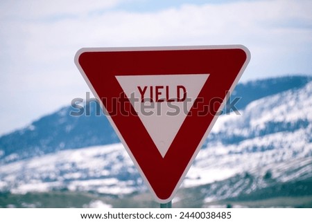 Yield Sign Post With Winter Background