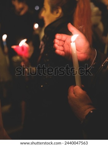 Greek Orthodox Christian Easter ceremony procession, divine worship service, worshippers hold candles, parishioners during an Easter vigil mass in a Cathedral, Athens, Attica, Greece, divine liturgy Royalty-Free Stock Photo #2440047563