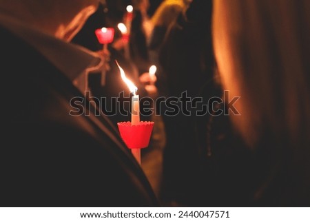 Greek Orthodox Christian Easter ceremony procession, divine worship service, worshippers hold candles, parishioners during an Easter vigil mass in a Cathedral, Athens, Attica, Greece, divine liturgy Royalty-Free Stock Photo #2440047571