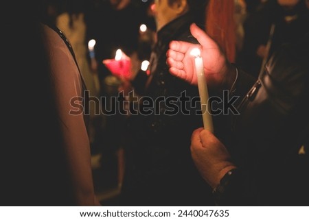 Greek Orthodox Christian Easter ceremony procession, divine worship service, worshippers hold candles, parishioners during an Easter vigil mass in a Cathedral, Athens, Attica, Greece, divine liturgy Royalty-Free Stock Photo #2440047635