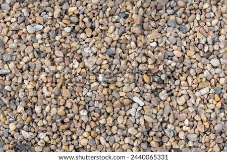 Seamless background ot texture made of multicolored pebbles