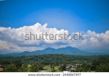 Aerial Mountain of tidar and Village with cloudy blue sky Royalty-Free Stock Photo #2440067497