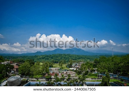 Aerial Mountain of tidar and Village with cloudy blue sky Royalty-Free Stock Photo #2440067505
