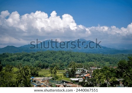 Aerial Mountain of tidar and Village with cloudy blue sky Royalty-Free Stock Photo #2440067551