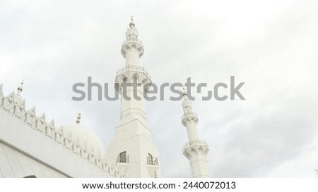 Aesthetic view of the majestic white towers at Syech Zayed Mosque Royalty-Free Stock Photo #2440072013
