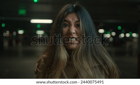 Mad angry crazy Asian korean chinese japanese girl shout in car parking furious woman annoyed businesswoman client speak loud screaming talk solve conflict feel anger rage talking scream webcam view Royalty-Free Stock Photo #2440075491