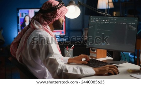 Experienced programmer writing code on computer screen while in office using Java programming languages. Developer working on fixing database errors while working from home