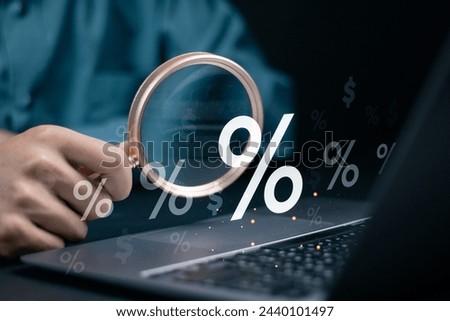Interest rate and dividend concept. Calculating income and return on investment in percentage. income, return, investment. Businessman use laptop with percentage icon on virtual screen.