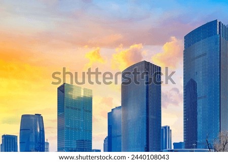 Witness the majesty of the city skyline with this dramatic photo capturing the silhouette of urban architecture against the backdrop of the setting sun. Bold skyscrapers, illuminated landmarks, and a 