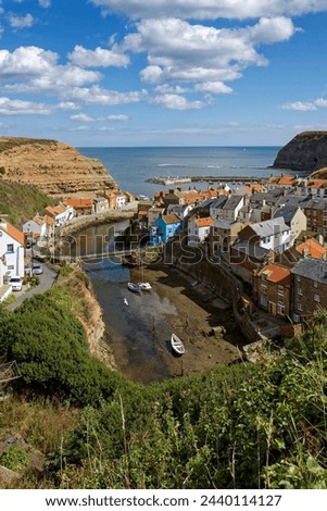 STAITHES, NORTH YORKSHIREUK - AUGUST 21 : View of Staithes Harbour North Yorkshire on August 21, 2010. Unidentified people Royalty-Free Stock Photo #2440114127