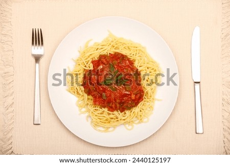 A picture of a plate of fresh spaghetti on the table