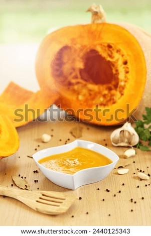 Picture showing pumpkin creamy soup with pinia nuts