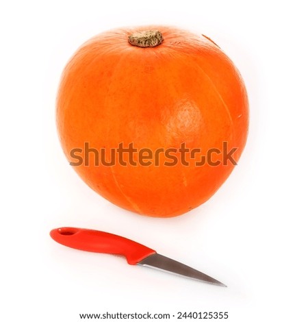 A halloween picture of a pumpkin and a knife over white background