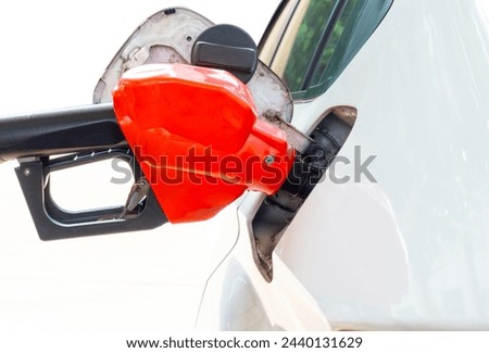 Refuel the car at the refueling point. Energy Concepts Gasoline Gasohol Alternative Energy Royalty-Free Stock Photo #2440131629