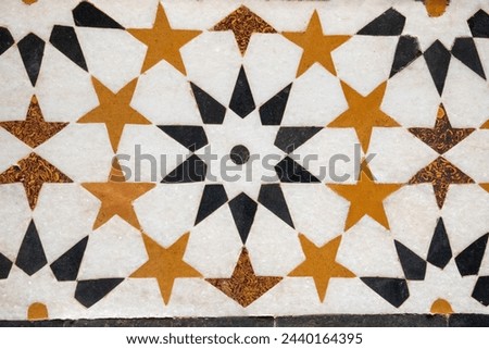 Beautiful marble inlay work. Pietra Dura inlay art technique used to build Taj Mahal, consists of Floral or Calligraphic inlays. Artwork of Taj Mahal is purely handmade by the highly skilled artisans. Royalty-Free Stock Photo #2440164395