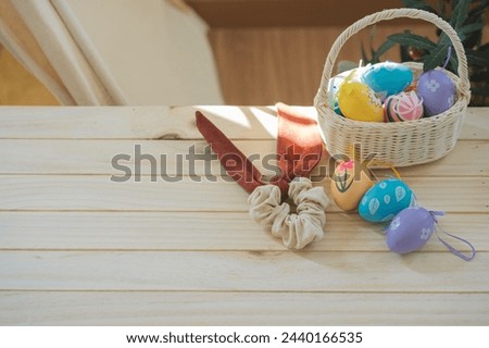 easter holiday concept with colorful egg and put in basket and put on wood table