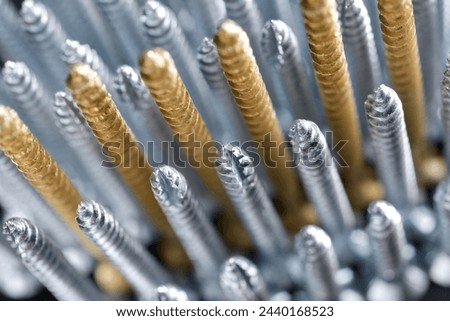 Close up of a large group of countersunk lag bolts for joining wood parts Royalty-Free Stock Photo #2440168523